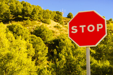 Traffic stop red sign by the road