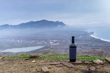 Canvas Print - Bottle of wine in the mountains