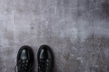 Wall Mural - Gray background with pair black boots