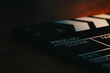 © artrolopzimages - Clapperboard photograph on a table in a local film production. Concept of film and video industry.