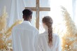 © Bargais - Back of couple in white clothes getting married on the cross of Jesus.