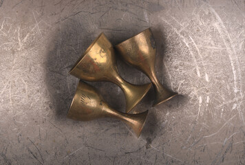 Poster - ancient bronze wine cups isolated on metal