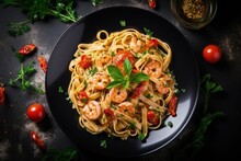 Top View Of Fettuccine Pasta With Shrimp Tomatoes And Herbs
