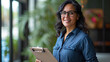 © Sasint - Middle age hispanic woman smiling confident holding clipboard at office