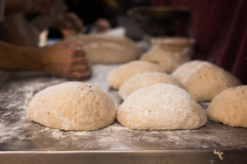 Wall Mural - Bread preparation. loaves of dough before baking