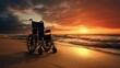 Wheelchair stands on the beach next to the sea with a view of the sunset