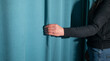 © andranik123 - Woman correcting curtain at home.