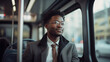 Cheerful Afroamerican man commuting to work in a bus.