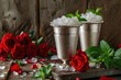 Two silver cups with crushed ice fresh mint red roses in a rustic setting