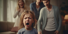 A Distressed Young Girl Screaming With A Blurred Family Arguing In The Background, Capturing A Moment Of Family Conflict Or Tantrum.
