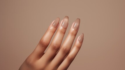 Wall Mural - Woman hand with nude shades nail polish on her fingernails. Nude color nail manicure with gel polish at luxury beauty salon. Nail art and design. Female hand model. French manicure Ai generated