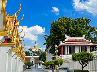 Wall Mural - A picture of a Thai temple in bright brass color overlooking the Golden Mountain of Wat Saket.