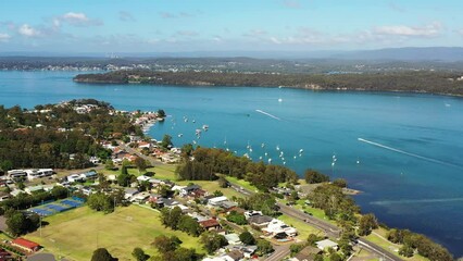 Poster - Eleebana residential town on Lake Macquarie shores in Australia – aerial flying 4k.
