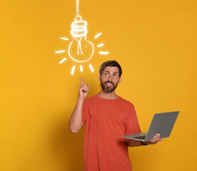 Wall Mural - idea generation. man with laptop on orange background. illustration of glowing light bulb over him