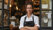 © MYDAYcontent - A woman stands confidently in front of a store, with her arms crossed.