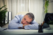 © Davizro Photography - Detail of a man sleeping on an office table