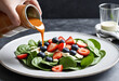 Top off a fresh spinach salad with dressing