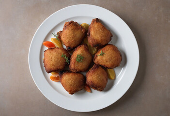 Spicy fried chicken thighs on a platter