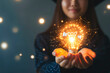 © Enrique - Education, e-learning graduate certificate and business concept, Women showing light bulb with graduation hat in hand Education technology study knowledge, human creative thinking idea