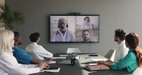 Wall Mural - Diverse group of doctors talking to remote colleagues on Internet video conference call, discussing medical expertise issues, consulting healthcare expert, disease diagnosis specialists