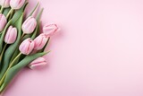 Fototapeta Tulipany - Beautiful composition spring flowers. Bouquet of pink tulips flowers on pastel pink background. Valentine's Day, Easter, Birthday, Happy Women's Day, Mother's Day. Flat lay, top view, copy space