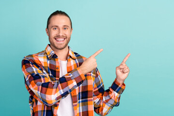 Sticker - Portrait of nice guy with beard long hairdo wear flannel shirt indicating at discount empty space isolated on turquoise color background