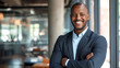 a portrait of a black male business man entrepreneur smiling 