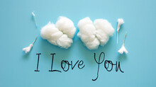 I Love You Message With White Cotton Clouds On Blue Background, Top View. 