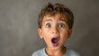 © Wendy2001 - Surprised, shocked or startled four year old preschool caucasian boy in awe left speechless with his eyes and mouth wide open on neutral gray background