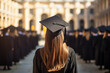 Female graduate student wearing a cloak and hat. Graduation ceremony or convocation with a blurred background