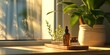 A bottle of essential oil sitting on a counter next to a potted plant. This image can be used to depict aromatherapy or natural remedies