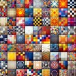 Squares of fabric of different colors and textures creating a matrix effect
