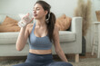 © ultramansk - close up of Young face caucasian fitness woman wearing sport clothes training indoor drinking fresh water. healthy lifestyle and wellness.