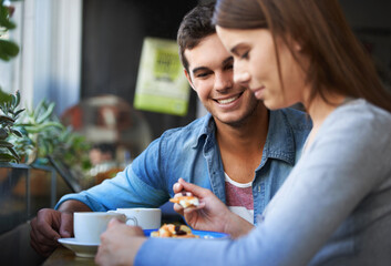 Sticker - Food, happy and couple eating in cafe, care and bonding together on valentines day date in the morning. Smile, man and woman in restaurant with breakfast coffee drink, love and relationship in shop