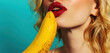 © lublubachka - Closeup portrait of young beautiful woman with banana on blue background