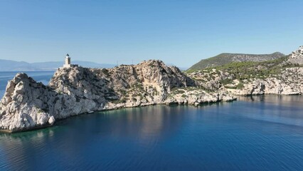 Wall Mural - Aerial drone video of beautiful and picturesque cape Melagavi forming a small peninsula with unique lighthouse stand out next to archaeological site of Heraion, Loutraki, Greece