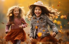 Happy Children Playing Outside With Leaves In Park During Autumn Fall Season