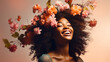 © ALA - A dark-skinned African woman with her head covered with spring flowers on a light beige background.