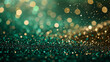 Shimmering golden bokeh on a blurred emerald green background with copy space. Focus on the radiant glow.