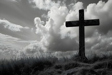 Wall Mural - A black and white image of a solitary cross stands against a dramatic background