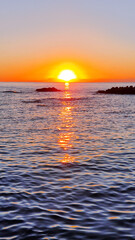 Wall Mural - Colorful sunset over the sea waves.Sunset sky over sea.