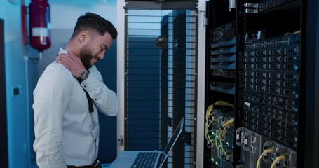 Canvas Print - Man, working and neck pain from injury or burnout from stress in server room with technician. IT, programmer and person tired from fatigue and fixing mistake, error or glitch in datacenter technology