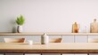 © Voilla - Empty dinning table with blurred kitchen background