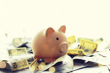 Sticker - 100 dollar bill and piggy bank on money background. Close up. Business, finance, investment, saving concept.