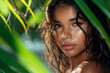 © Nataliia_Trushchenko - blue-eyed woman with freckles in the jungle peeks out from behind a tropical palm tree. Beautiful woman with green leave near face and body. Closeup girl's face with green leave