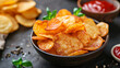 © olindana - Homemade air-fried potato chips with paprika. Healthy snack American cuisine concept
