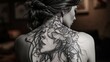 a woman's back tattoo