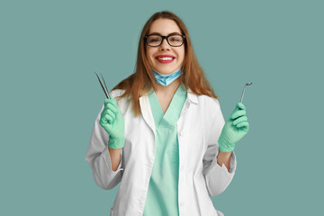 Poster - Female dentist with dental tools on blue background. World Dentist Day