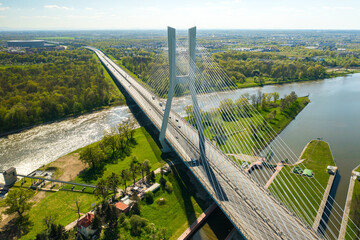 Wall Mural - Redzinski Bridge built over long Oder river with shimmering water near dam flowing at Wroclaw. 