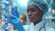 African-American lab technician wearing a medical scrubs and cap in a well-lit modern laboratory looks at a spiral of DNA in a test tube. In the background, the future depicted child is imagined..
